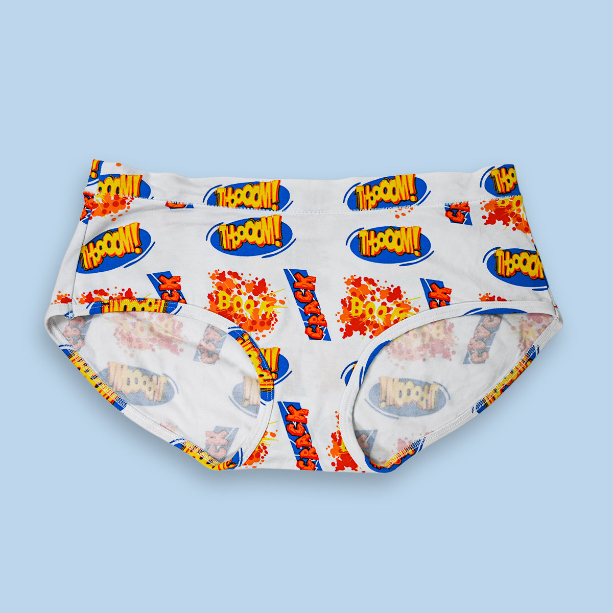 Hipster cut underwear with a colorful patterned design on a light blue background
