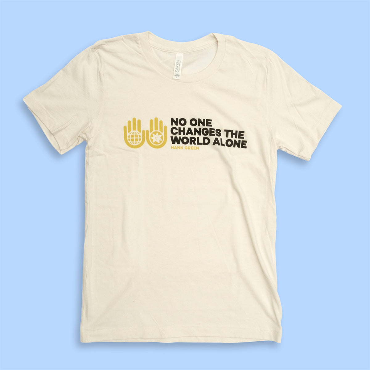 Beige t-shirt with black and yellow text and graphics on a blue background