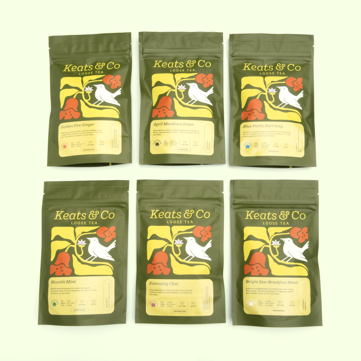 Six Keats & Co loose tea packages arranged in two rows of three against a white background. Each package features identical olive green pouches with the brand's logo showing a white bird on a yellow background with orange flowers. The varieties are clearly labeled on yellow information panels. Each package displays brewing information and servings (20 servings/50 grams), with some marked as caffeine free and others caffeinated.