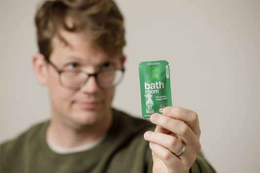 Image of Hank Green holding a Bathroom cleaning tablet from Green Llama and Good Store