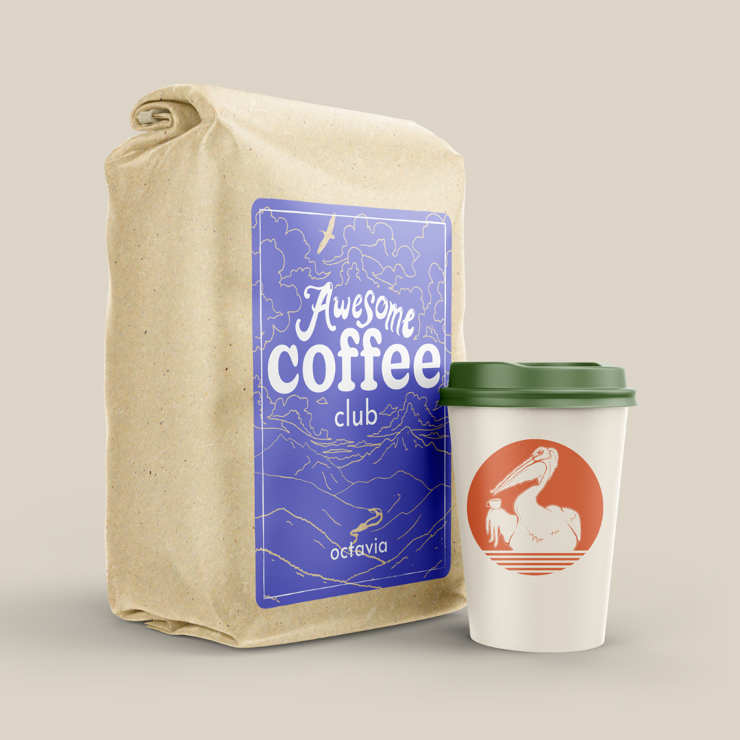 A large brown bag with a purple label on the front that reads "Awesome Coffee Club; Octavia". There is a white to go coffee mug next to it with a green lid and an orange pelican badge. A Good Store subscription product.
