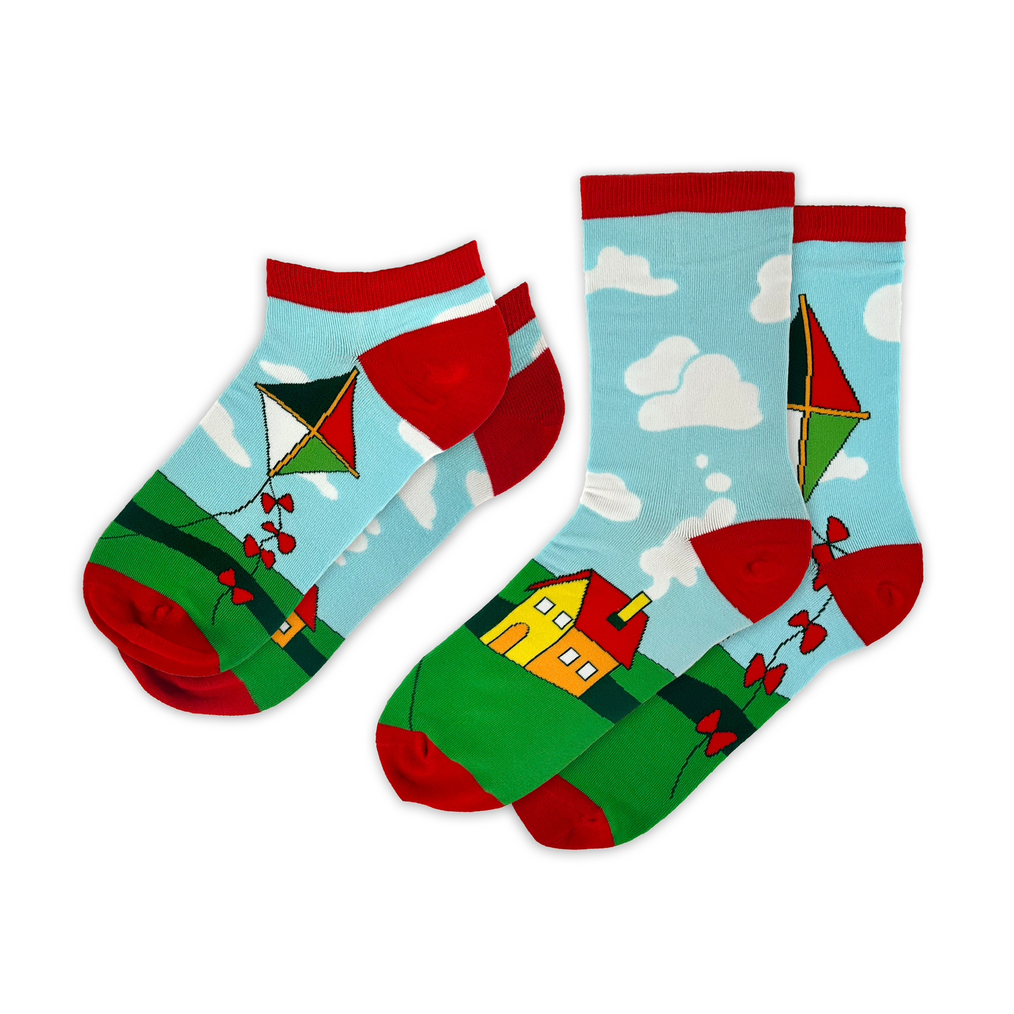 Colorful socks with kite and house design. One ankle-length, one crew-length. Sky blue background with clouds, green grass, red trim, and a yellow house. Home - Awesome Socks Club.