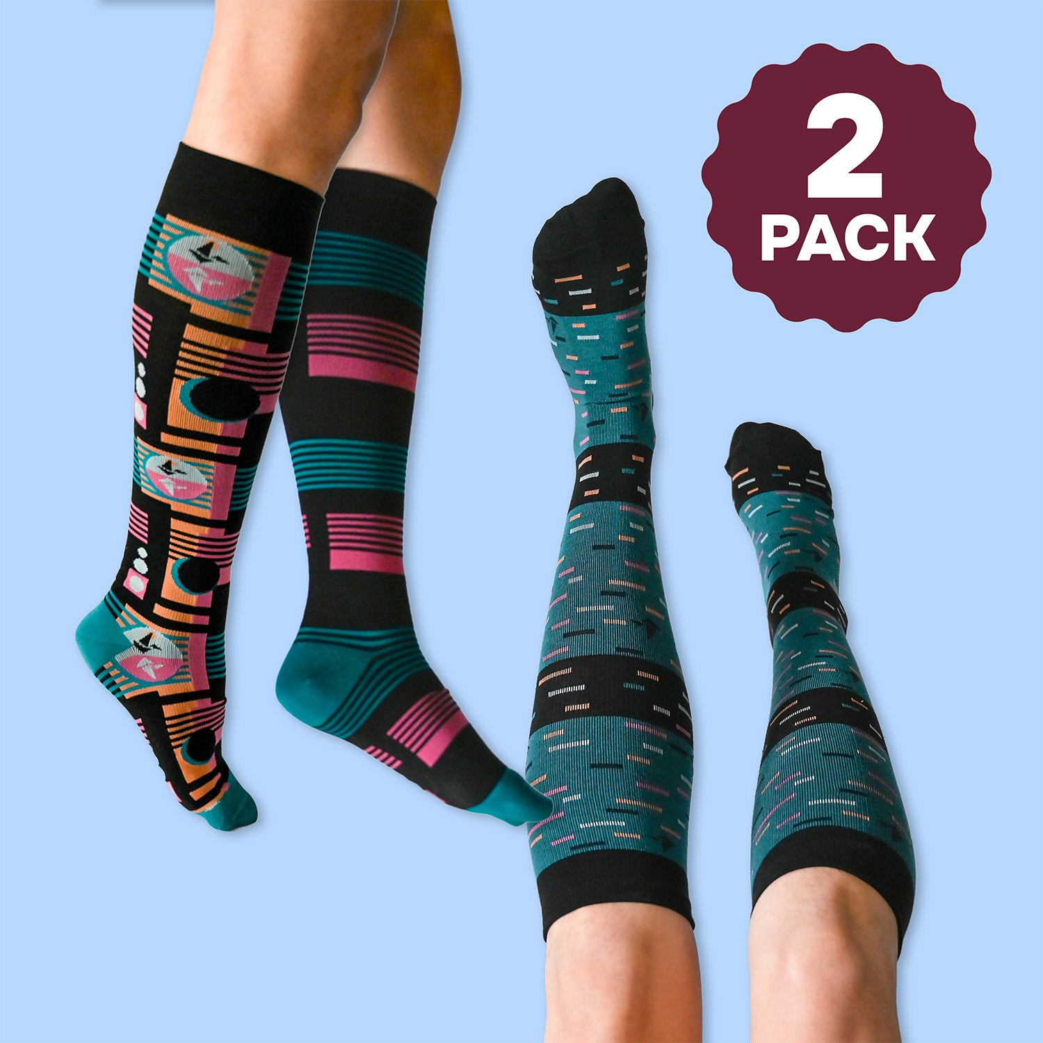 Two pairs of patterned knee-high socks on a person's legs with a '2 Pack' label on a light blue background.