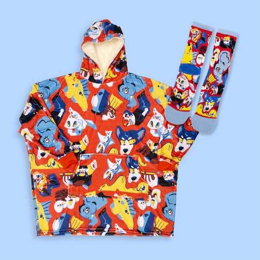 Blanket hoodie and wools socks with cartoon character pattern on a light blue background