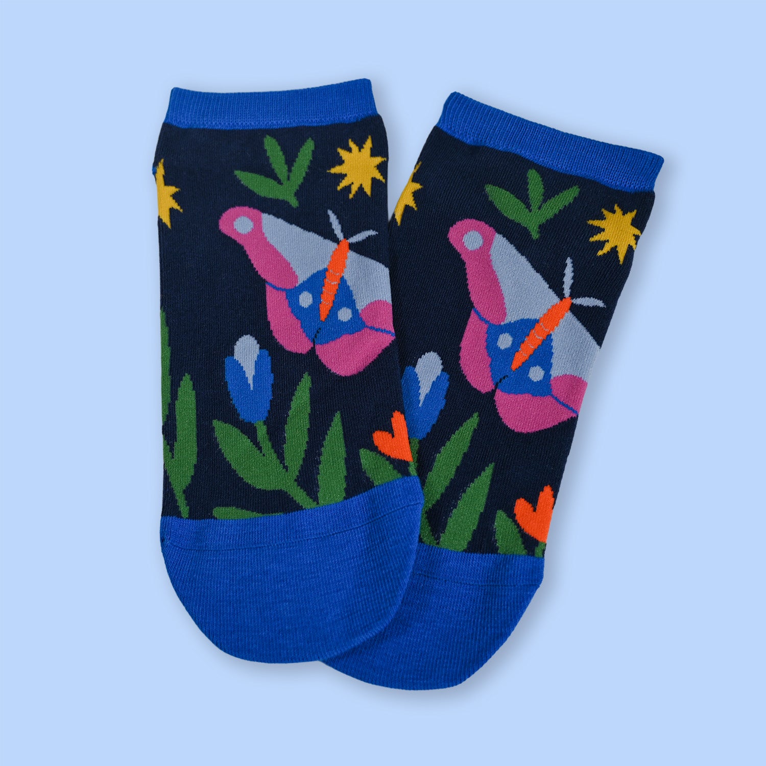 Pair of socks with moth design on a light blue background