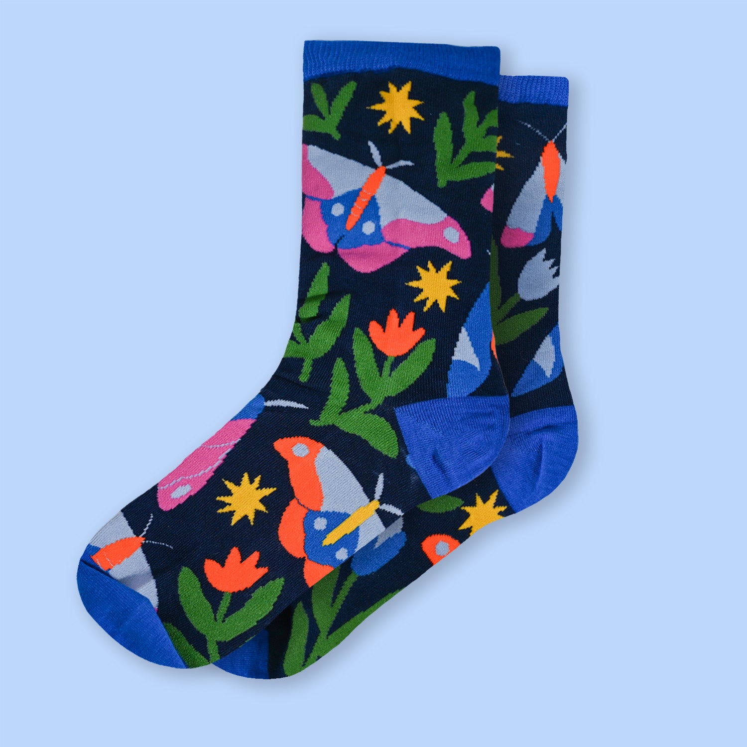 Colorful socks with moth and flower pattern on a light blue background