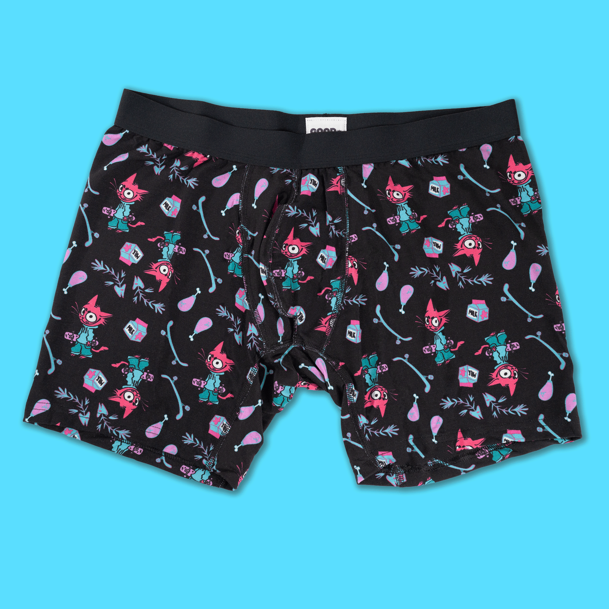 Black boxer briefs with a colorful cartoon pattern of red foxes, teal foxes, pink balloons, and blue arrows, shown flat against a bright cyan background.