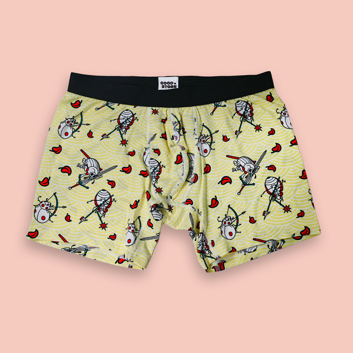 Yellow boxer briefs with cartoon character pattern on a pink background