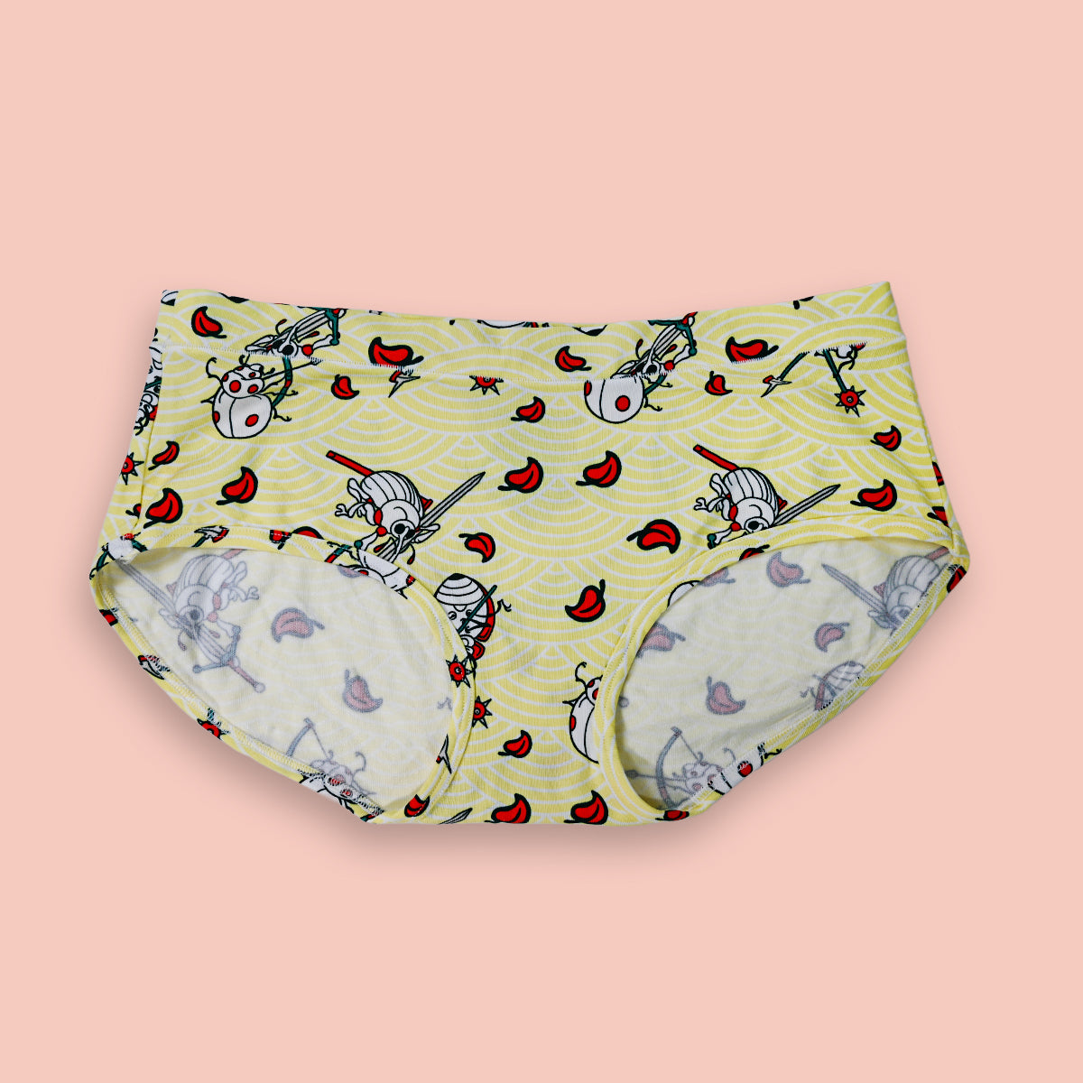 Pair of underwear with cartoon character pattern on a pink background