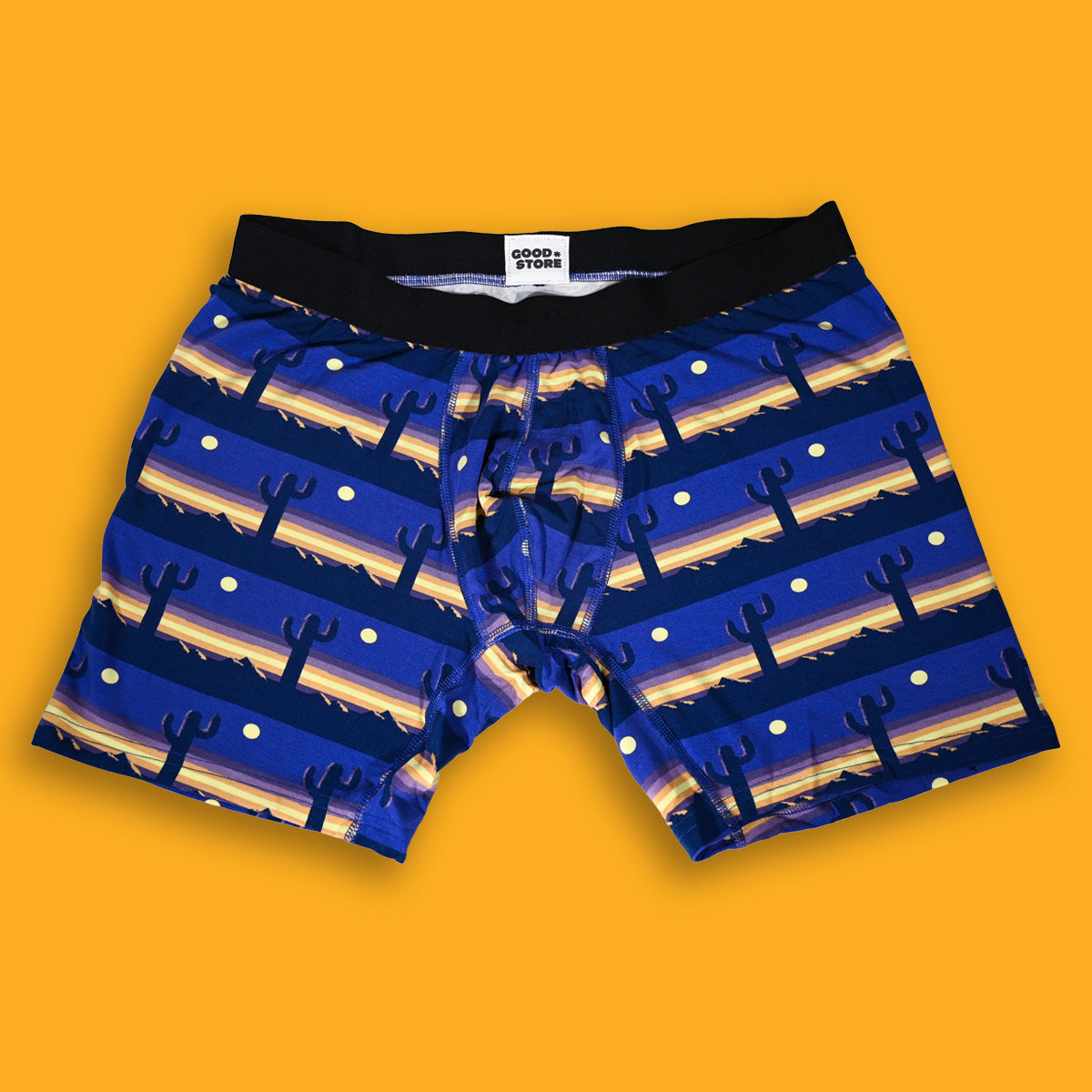 Blue boxer briefs with cactus pattern on a yellow background