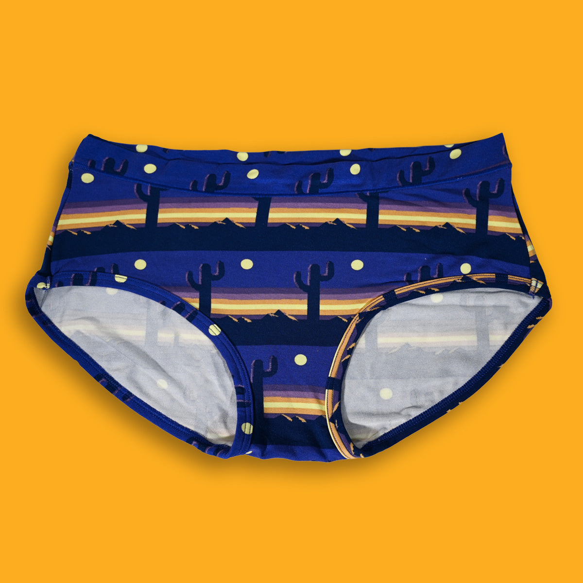 Blue underwear with a sunset design on a yellow background
