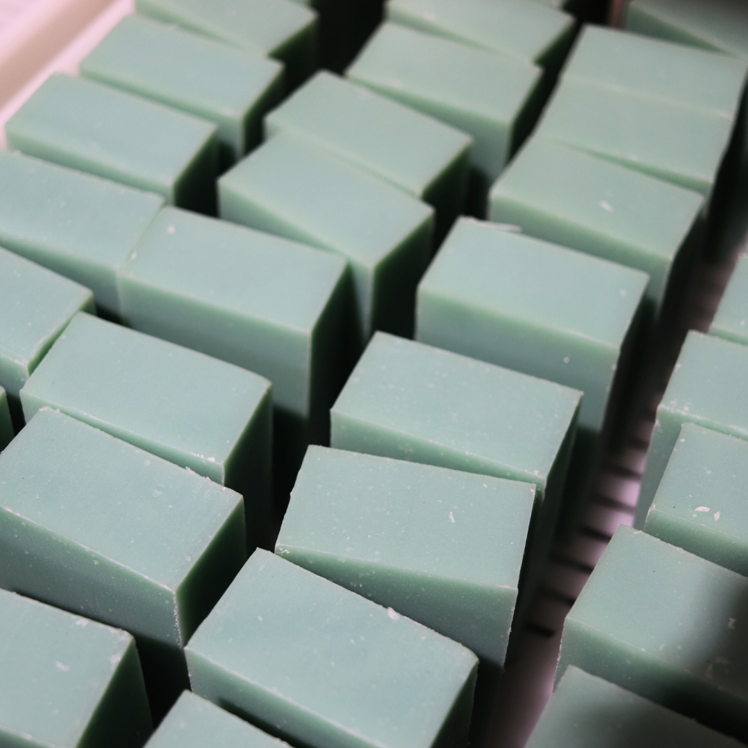 Close-up of green soap bars stacked together