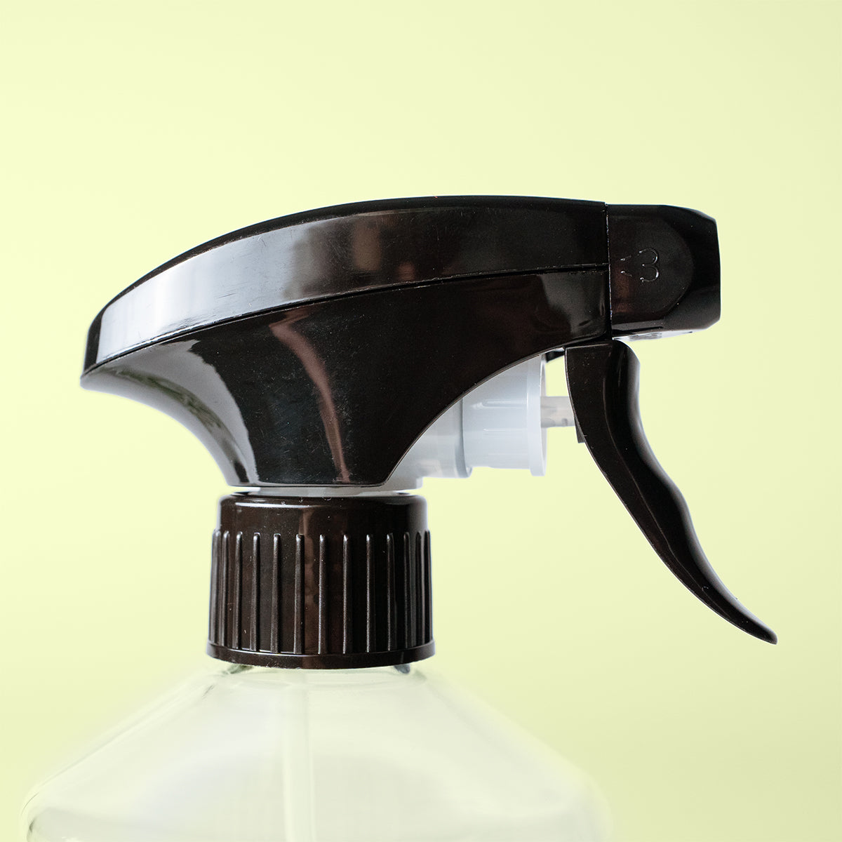 Black spray nozzle on a beige background