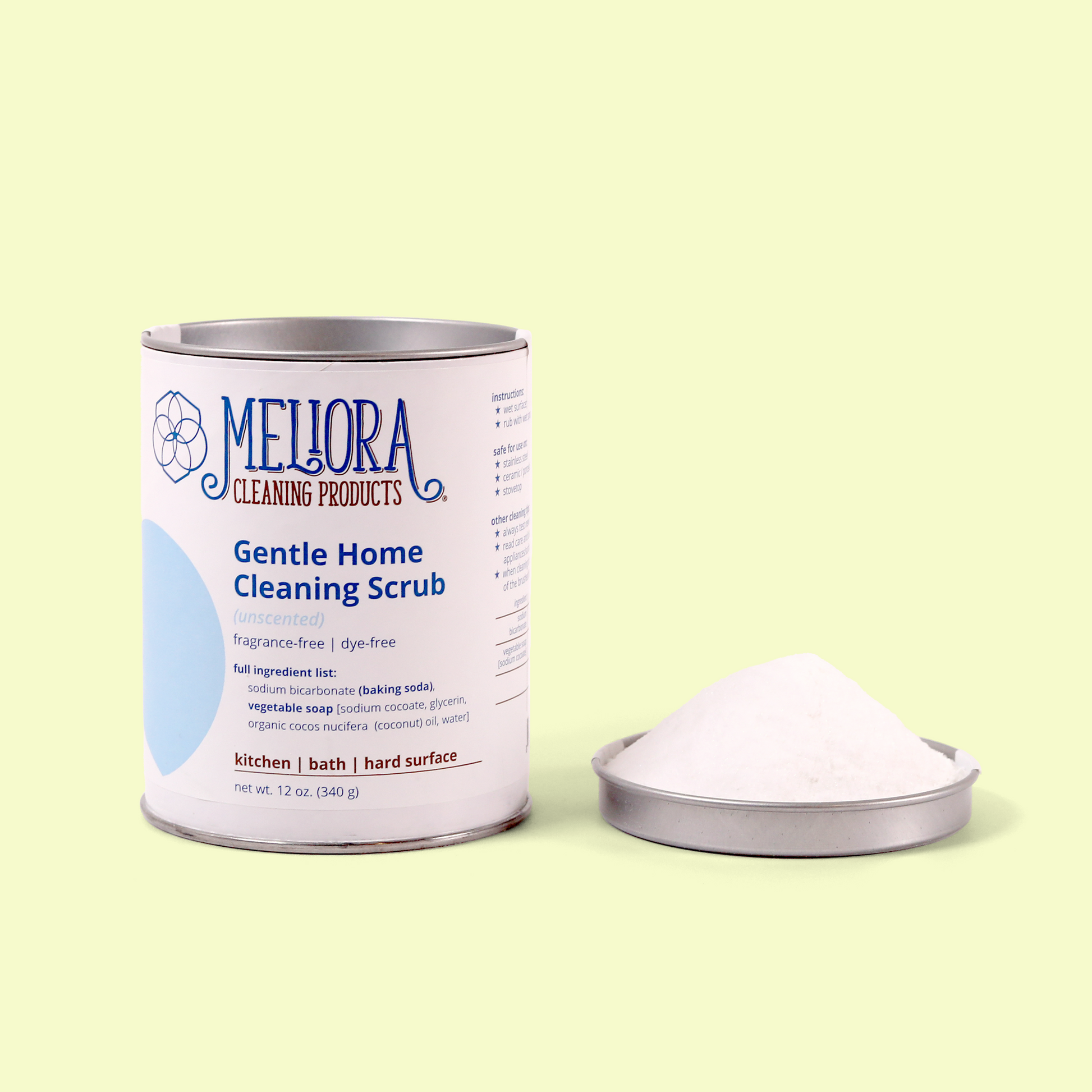 An unscented Meliora Gentle Home Cleaning Scrub container with its lid displayed beside it filled with white powder. The container features a blue accent circle and details that it's fragrance-free, dye-free, and contains baking soda and vegetable soap for cleaning kitchen, bath, and hard surfaces. The product weighs 12 oz (340g). Gentle home cleaning scrub from EcoGeek a Good Store product.