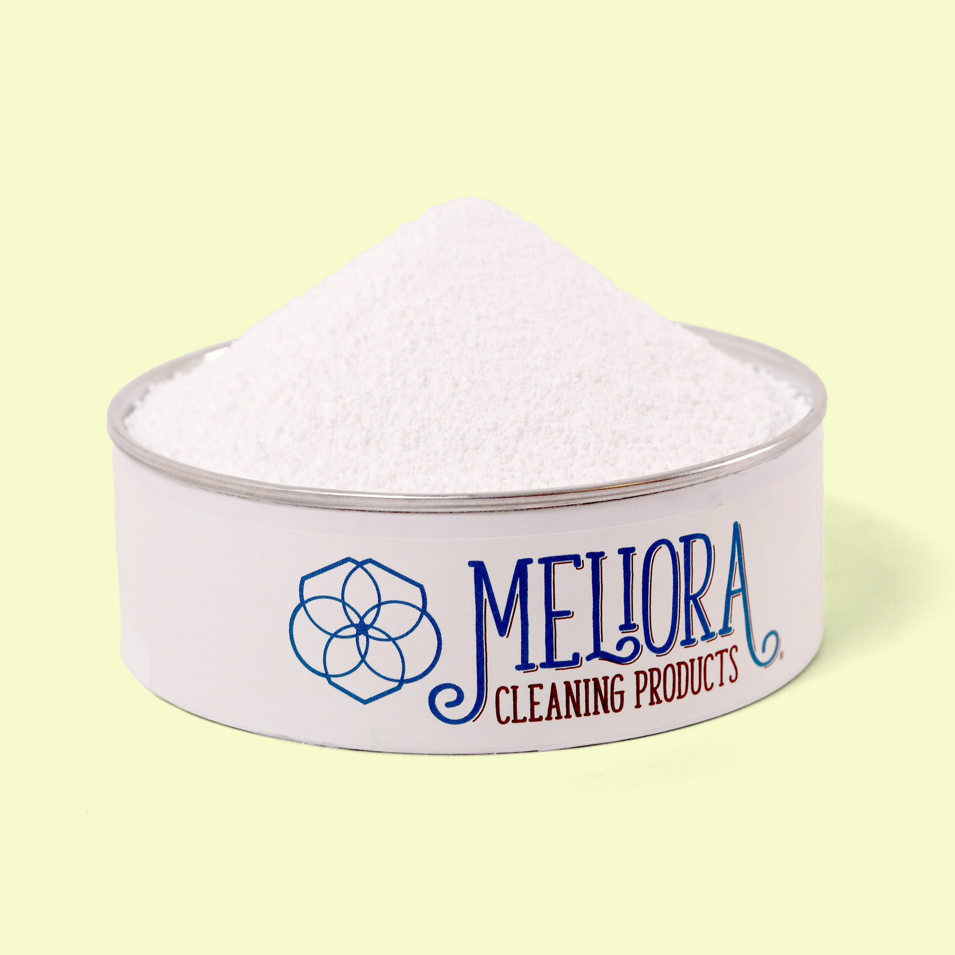 A close-up of a Meliora Cleaning Products container lid filled with a mound of white powdered oxygen brightener. The white metal lid features the Meliora logo (a geometric flower design) and "MELIORA CLEANING PRODUCTS" in blue and burgundy text. The fine white powder is heaped in a conical shape against a pale yellow background. Oxygen brightener bleach alternative from EcoGeek a Good Store product.