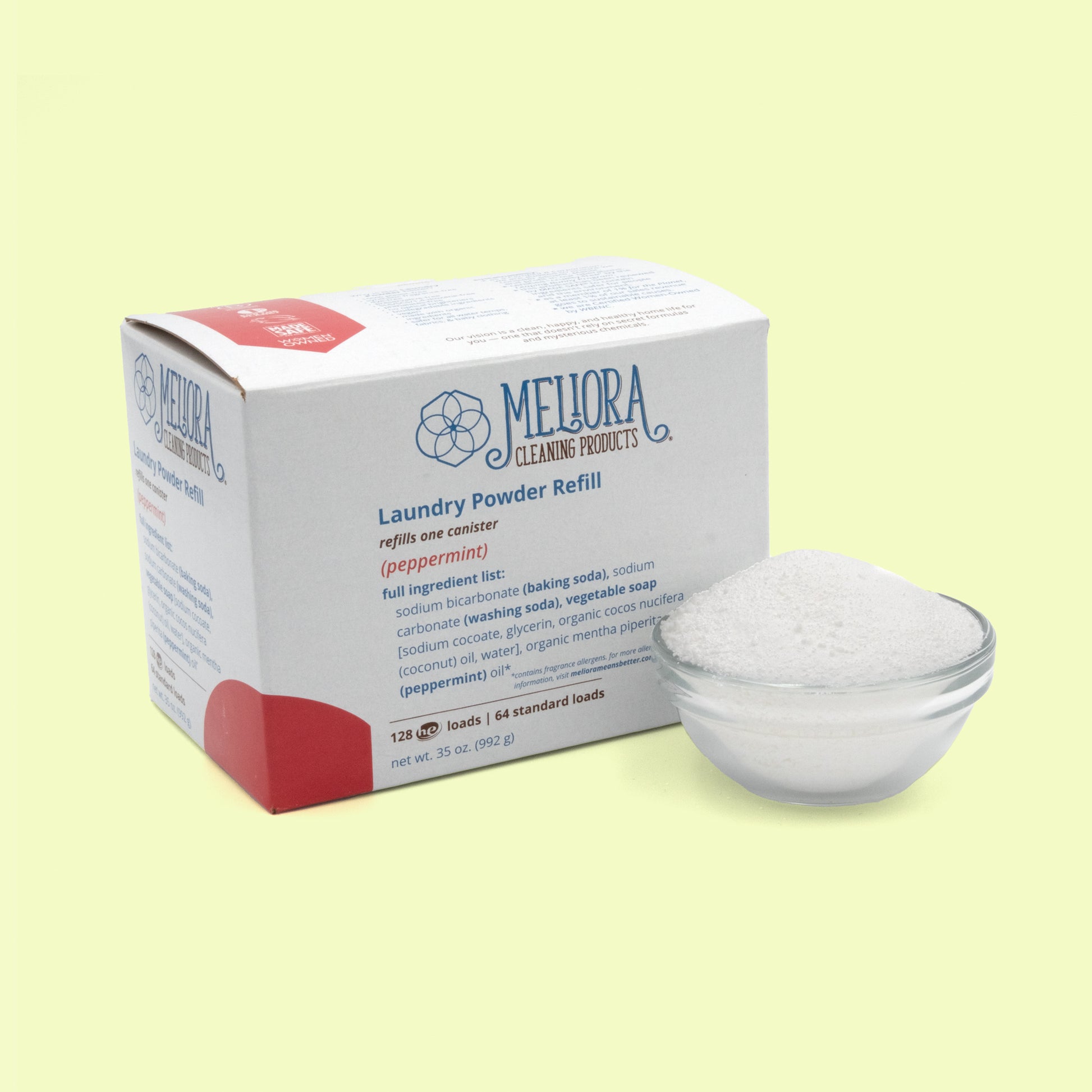 A white cardboard box of Meliora Cleaning Products Laundry Powder Refill in peppermint scent, with red accent coloring and the same geometric flower logo. A clear glass bowl of white laundry powder sits beside the box. The box shows ingredient information and indicates it refills one canister with 128 HE loads or 64 standard loads, net weight 35 oz.