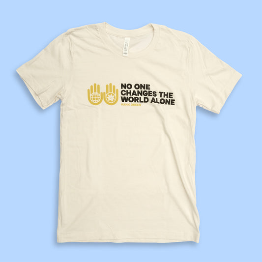 Beige t-shirt with black and yellow text and graphics on a blue background