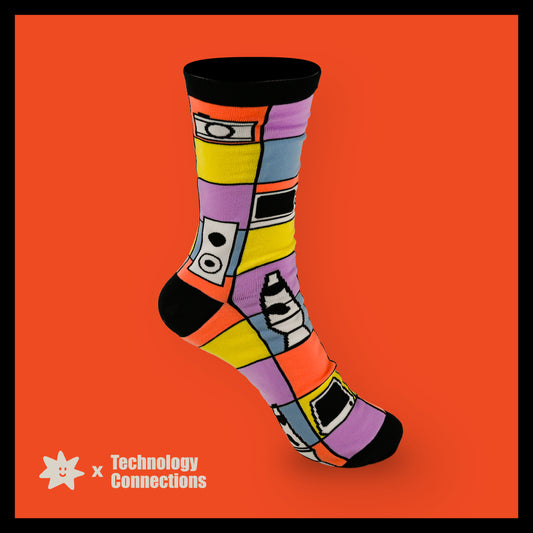 Colorful sock with geometric patterns on an orange background, featuring 'Technology Connections' branding.