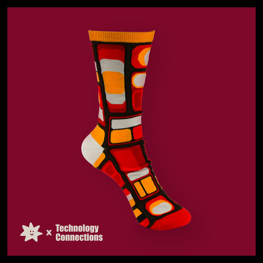 Colorful sock with geometric pattern on a red background, featuring 'Technology Connections' logo.