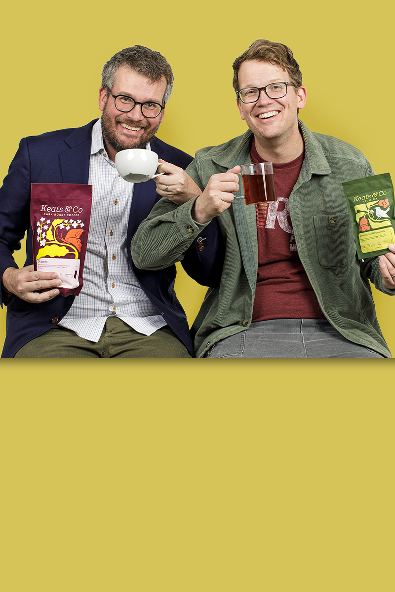 John and Hank Green enjoying Keats & Co coffee and tea against a yellow background