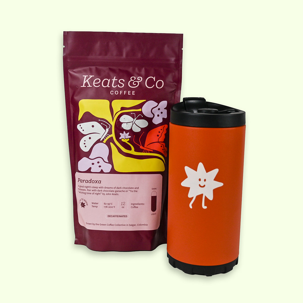 Keats & Co coffee package and orange french press on a light beige background