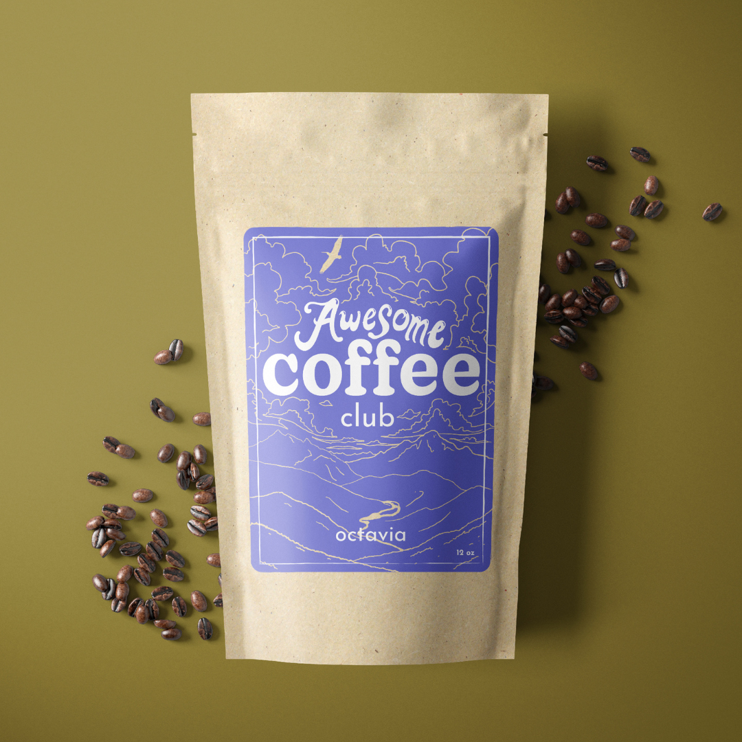 A photo of a brown bag of coffee with a light purple label that shows a mountain scene and has the text "Awesome Coffee Club; Octavia". The bag sites atop a dark yellow/green background with whole beans spread around it. A Good Store subscription product.