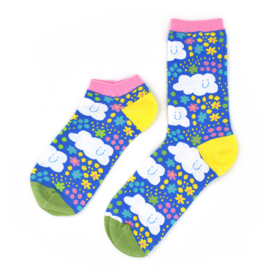 Two past designs from the Awesome Socks Club, one ankle, one crew, with a gradient that goes from dark blue to pink and features UFOs and aliens. A Good Store product.