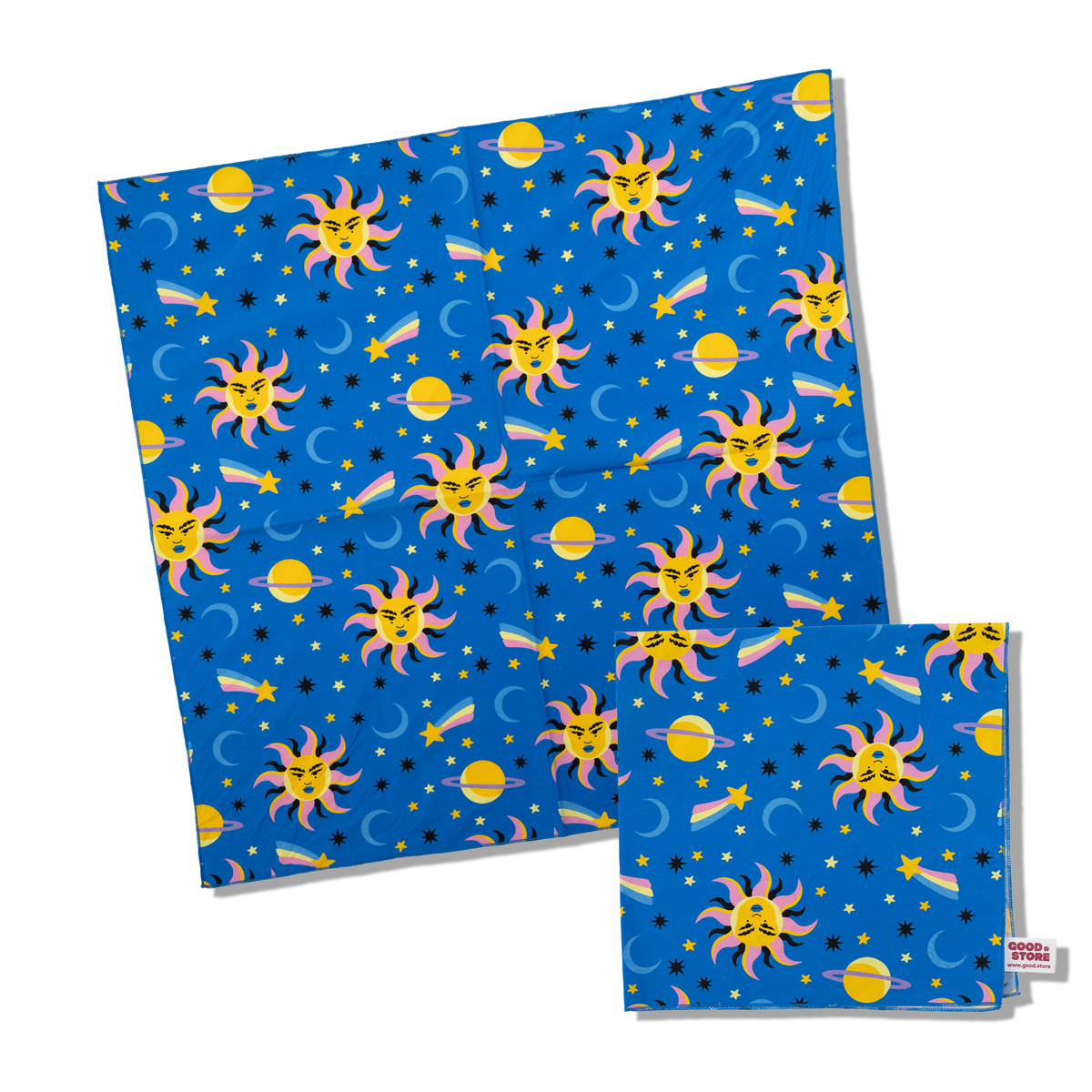 A blue fabric bandana, featuring a repeating cartoon space pattern of smiling suns, crescent moons, stars, and planets. A smaller matching folded version is placed in front on a clean white background.